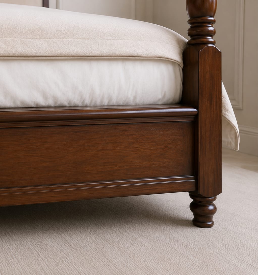 Close view of the acorn finial and post junction on the handmade teak four poster bed