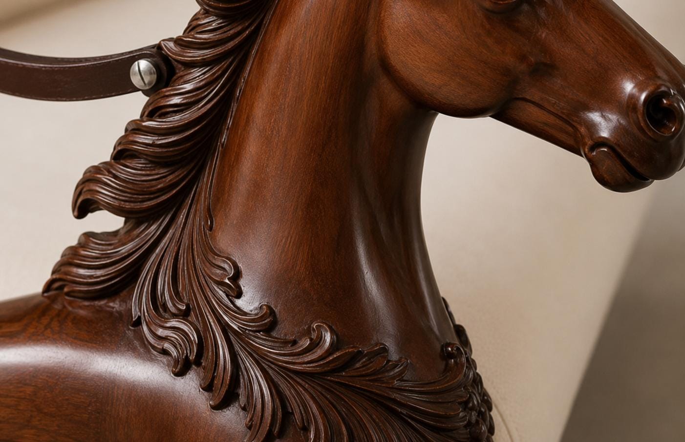 Full length view of the hand carved horse sofa styled in a vintage living room with classic decor and layered cushions
